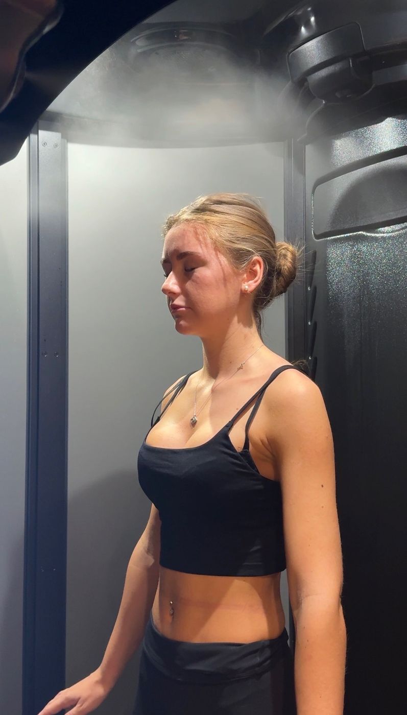 A full-body hydration session inside the WellFit booth